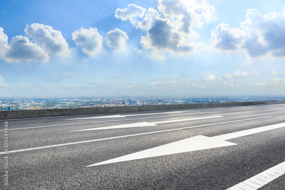 Fototapeta premium Asphalt highway and city skyline with clouds scenery in Shanghai.