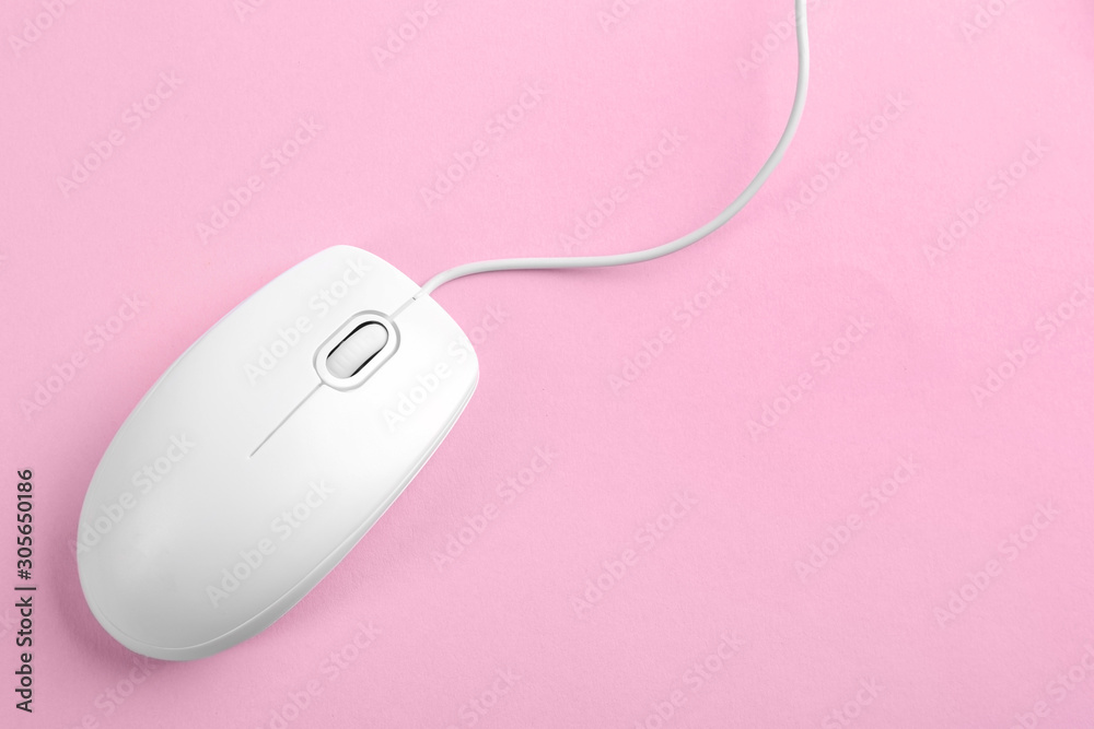 Modern wired optical mouse on pink background, top view Modern wired optical mouse on pink background, top view