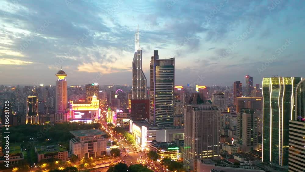 Shanghai, China - 31 August 2019: Zoom in Drone View of the People Square in Shanghai China on a sunset.