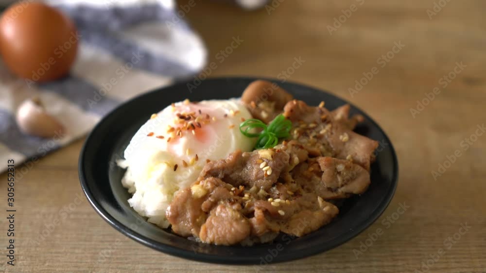 stir-fried pork with garlic on topped rice with egg - asian food style stir-fried pork with garlic on topped rice with egg - asian food style
