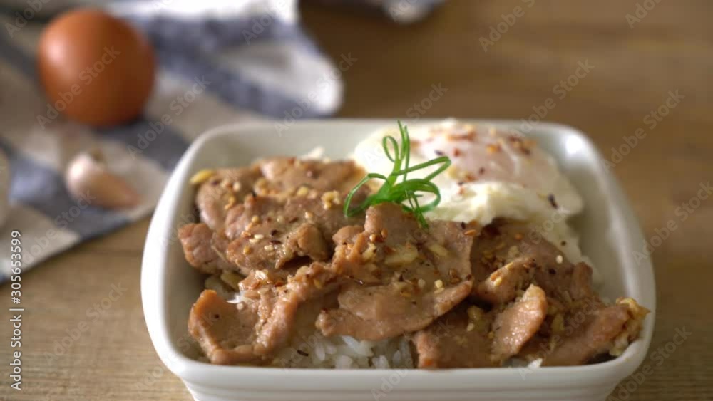 stir-fried pork with garlic on topped rice with egg - asian food style stir-fried pork with garlic on topped rice with egg - asian food style