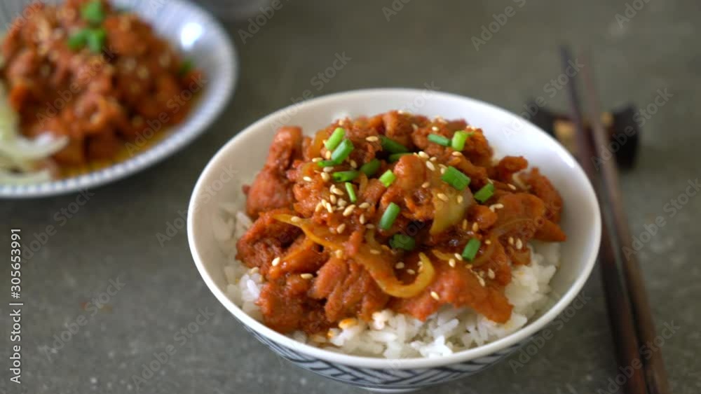 fried pork with spicy korean sauce (bulgogi) on top rice fried pork with spicy korean sauce (bulgogi) on top rice