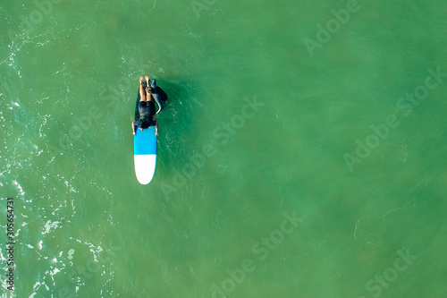 surf instructor and woman learning extreme water sport in Goa