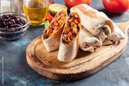 Burritos wraps with mincemeat, beans and vegetables