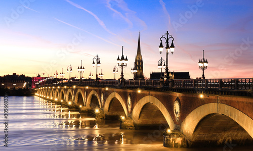 View of the Pont de pierre with sunset sky scene which The Pont de pierre crossing Garonne river 