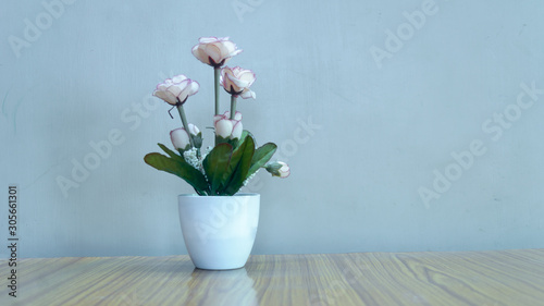 Vase with beautiful rose flowers on table. Copy Space room for text for your holiday background decoration.