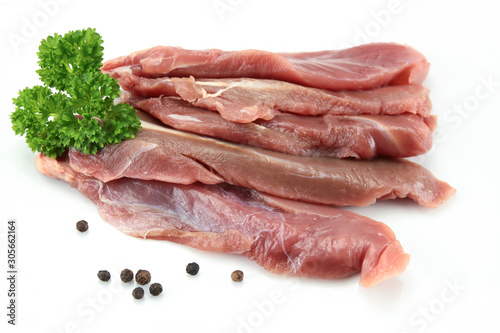 duck breast raw and cut on a white background