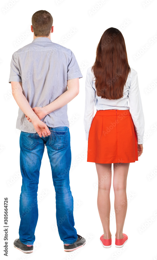 Back view of couple. beautiful friendly girl and guy together.