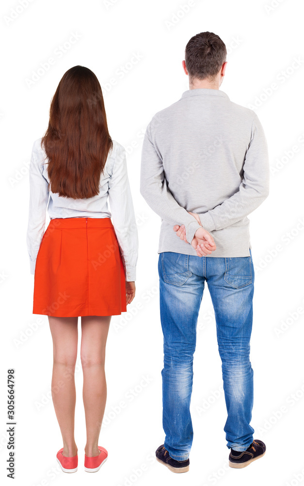 Back view of couple. beautiful friendly girl and guy together.