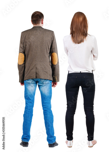 Back view of couple. beautiful friendly girl and guy together.