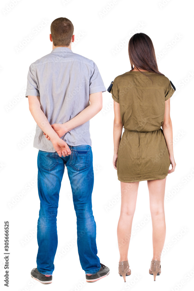 Back view of couple. beautiful friendly girl and guy together. Back view of couple. beautiful friendly girl and guy together.