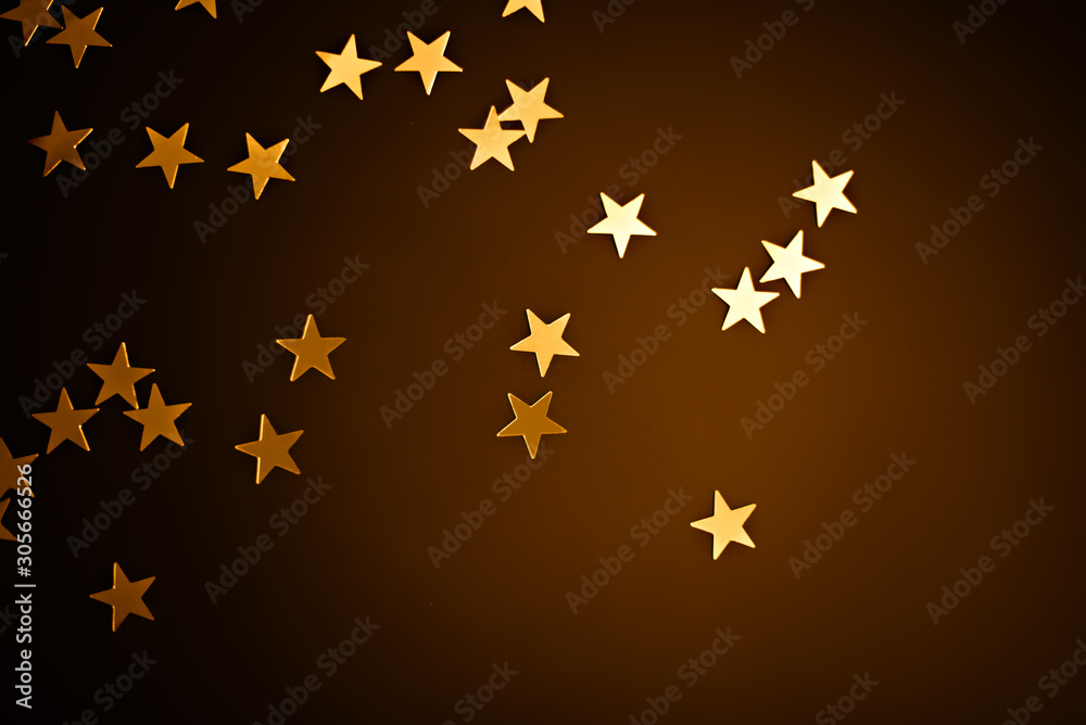 Trendy gold stars confetti falling on dark brown gradient background. Trendy gold stars confetti falling on dark brown gradient background.