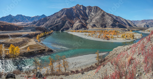 The confluence of two rivers, Katun and Chuya in the mountains of Altai. Panoramic autumn view, sunny day. Travel and leisure in the mountains.