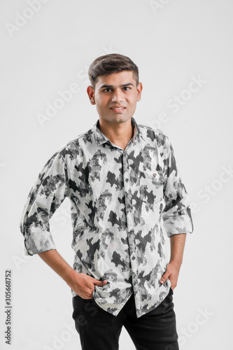 young indian man Standing over white background