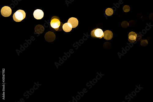 Abstract gold bokeh with black background photo