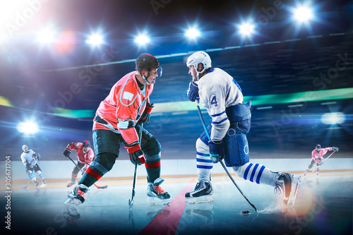 Professional hockey players in action on grand arena