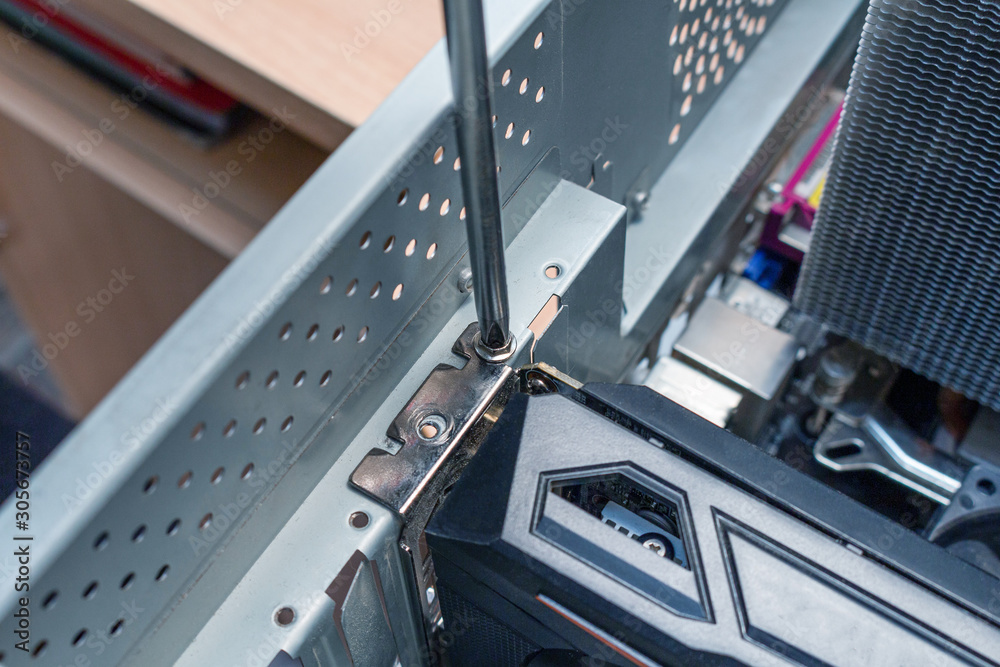 Screwing pci express video card on a place in the service Screwing pci express video card on a place in the service