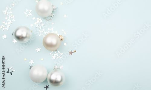 christmas balls and stars on light blue background
