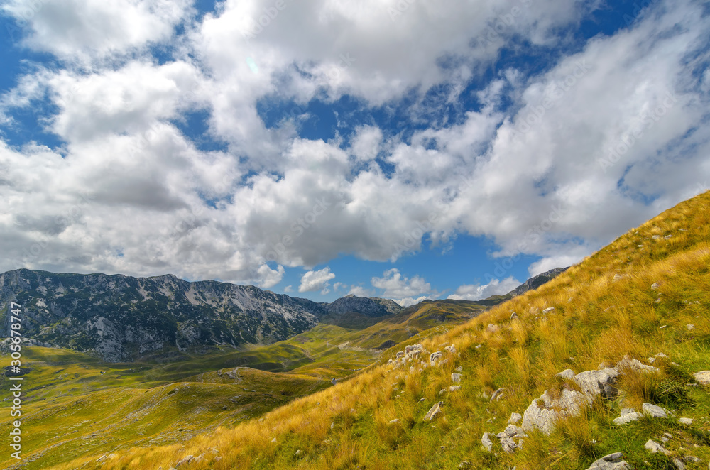 Summer mountaine landscape with cloudy sky. Mountain scenery, National park Durmitor, Zabljak, Montenegro.