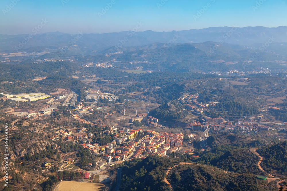 aerial view of beautiful nature and settlement on the downhill