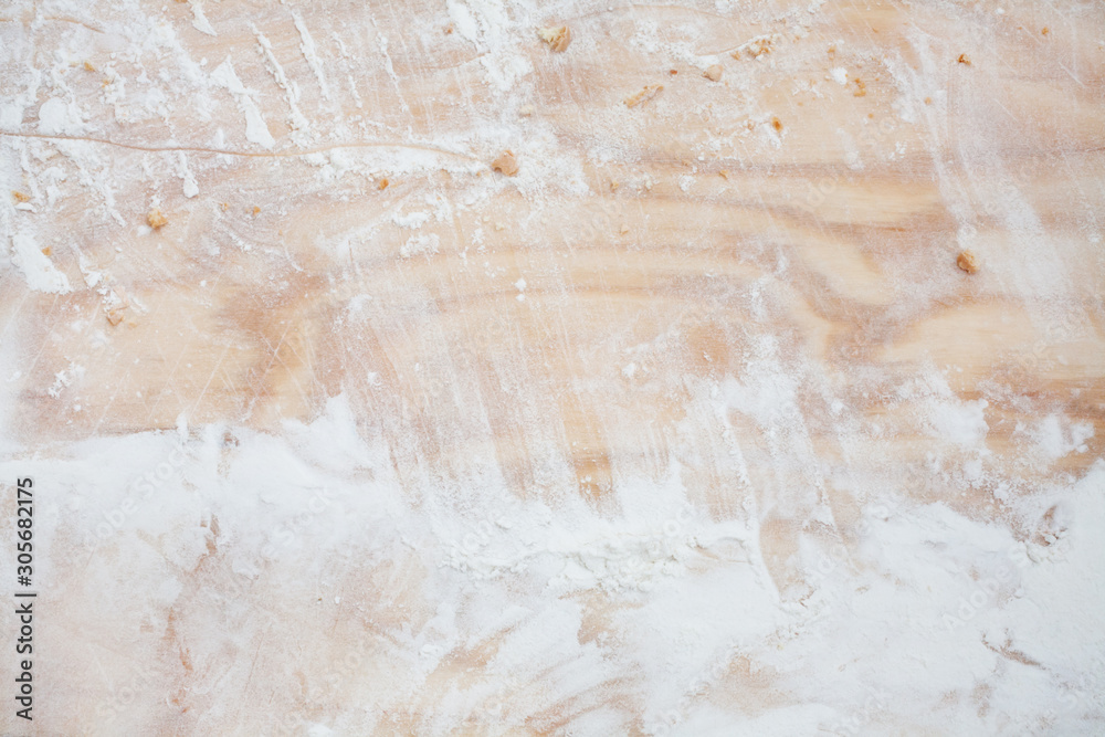Cutting wooden Board with crumbs from baking and flour. Top view. Copy space. Cutting wooden Board with crumbs from baking and flour. Top view. Copy space.
