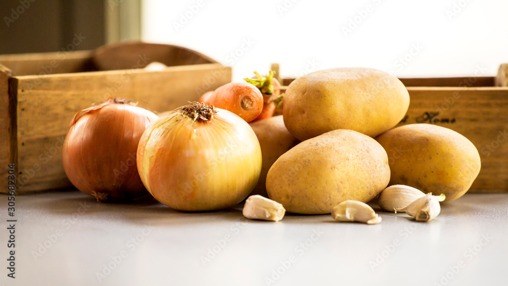 onion potatoes and carrots close up root vegetable onion potatoes and carrots close up root vegetable