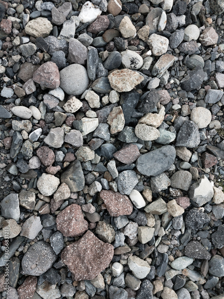 Background of multicolored stones of different shapes, background Background of multicolored stones of different shapes, background