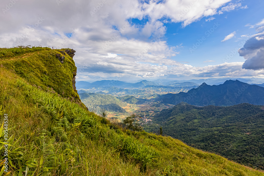 Fototapeta premium Small village in the middle of the valley in Laos, when viewed from the Thai side