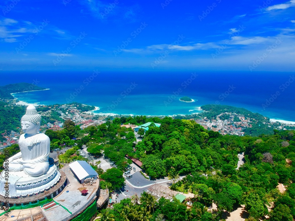 Drone panorama Aerial Views of Big Buddha Phuket Thailand kata and karon beach in background turquoise waters 