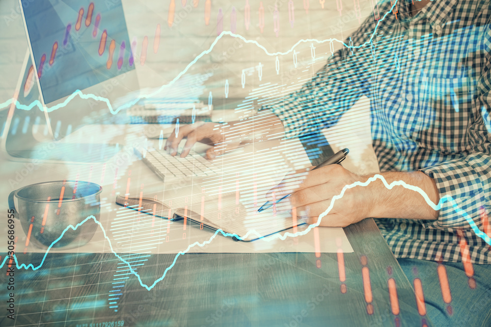 Double exposure of stock market chart with man working on computer on background. Concept of financial analysis. Double exposure of stock market chart with man working on computer on background. Concept of financial analysis.
