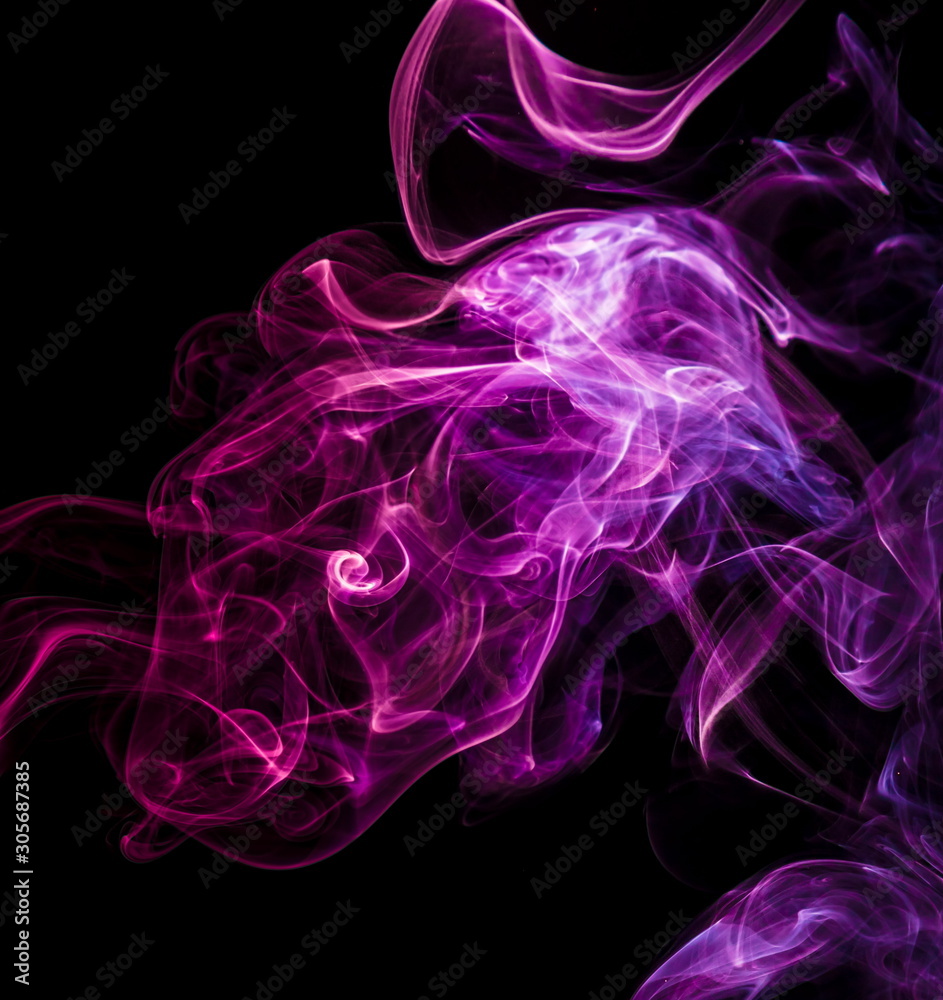 Fototapeta premium Colored smoke on black background