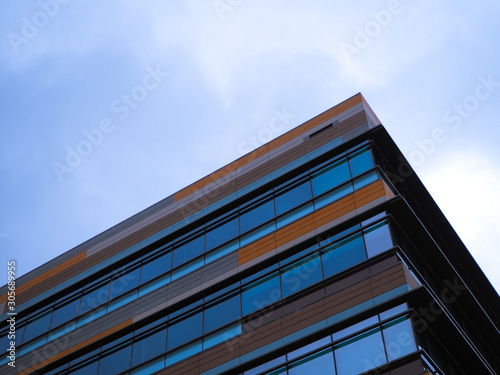 abstract orange blue commercial building in business park