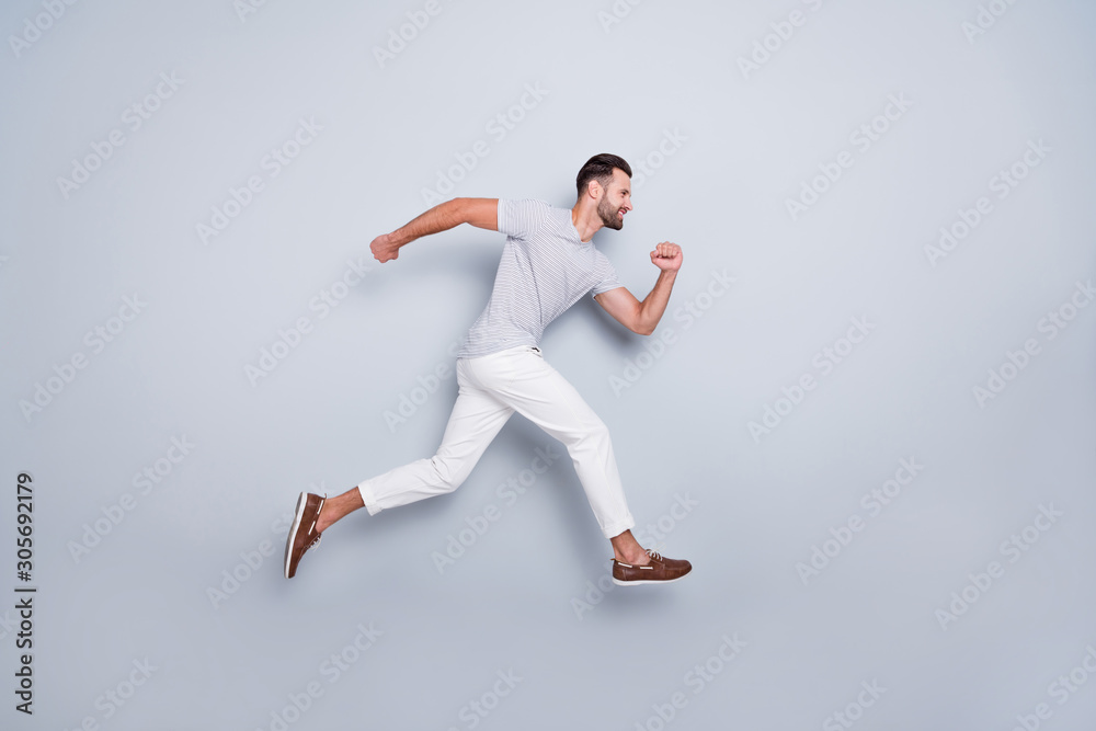 Full length body size view of his he nice attractive muscular sportive cheerful strong bearded guy running fast hurry-up isolated over light grey pastel color background