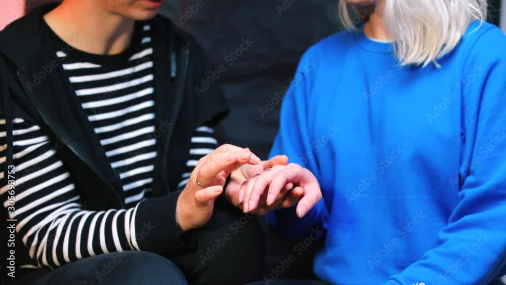 A girl examines the ring of her partner. A girl examines the ring of her partner.