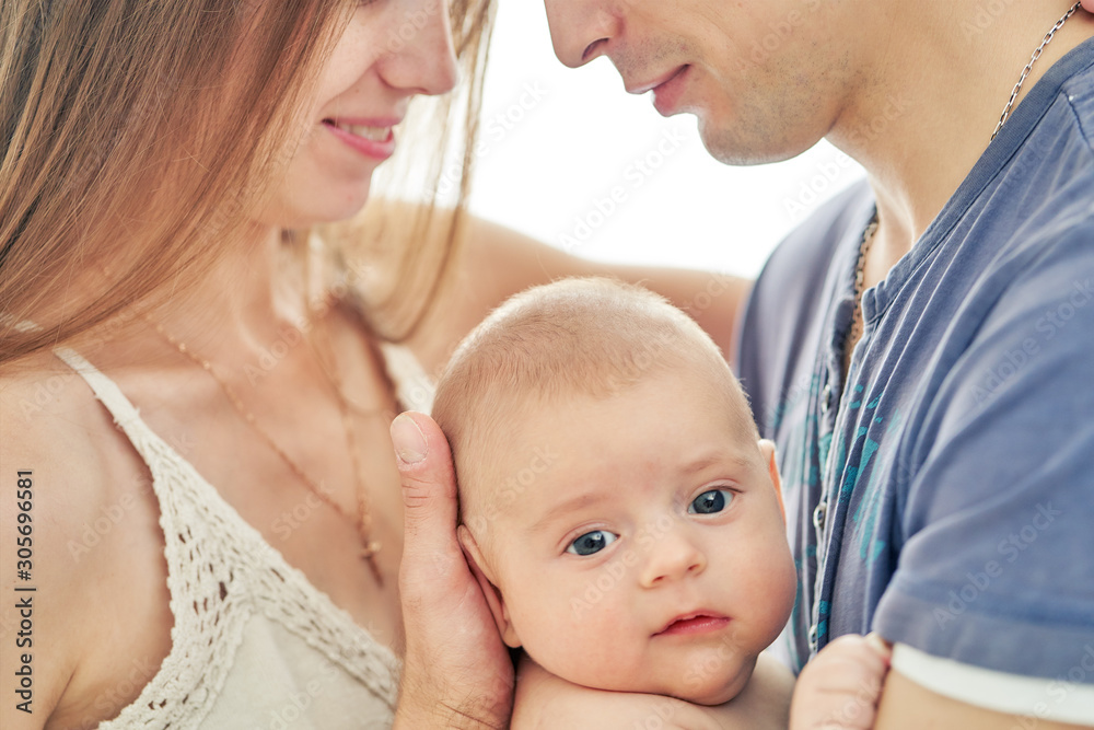 young couple with newborn baby. selective focus closeup young couple with newborn baby. selective focus closeup
