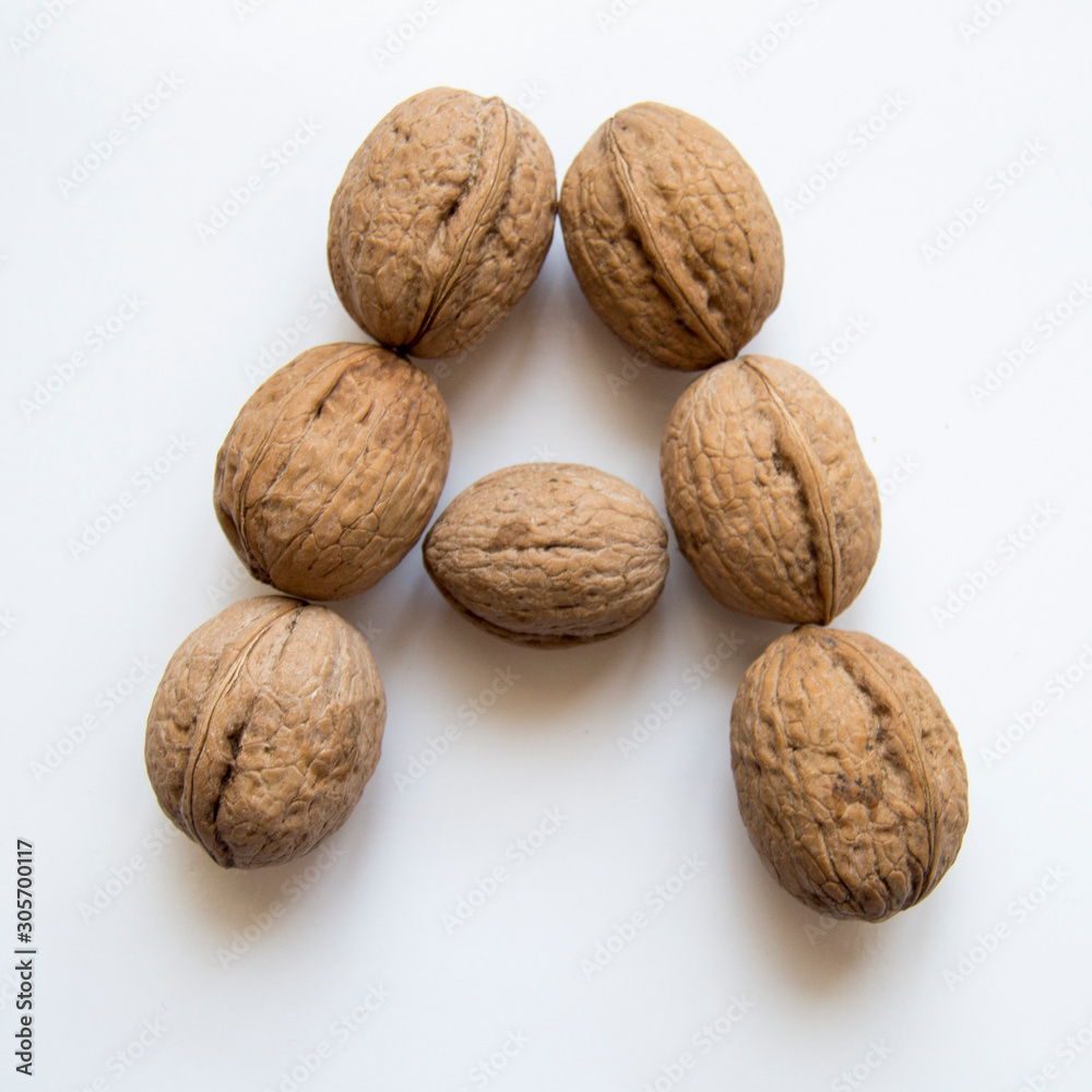 Capital letter A from walnuts on white background Capital letter A from walnuts on white background