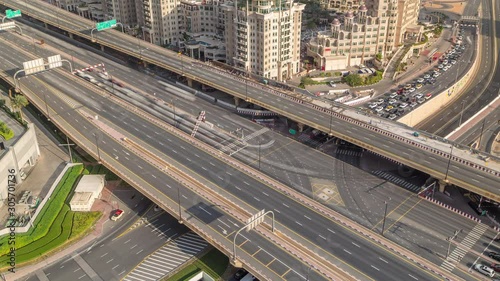 Aerial view of highway interchange in Dubai downtown morning timelapse. Al Saada street and Financial center road. Cityscapes traffic bridge, logistics. Roads and lanes Crossroads, Dubai, United Arab photo