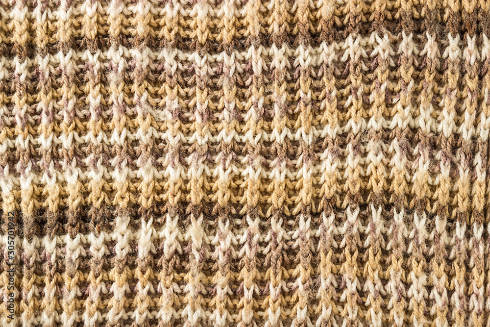 Fototapeta premium Knitted background. Knitting Pattern. A sample of knitting from wool.