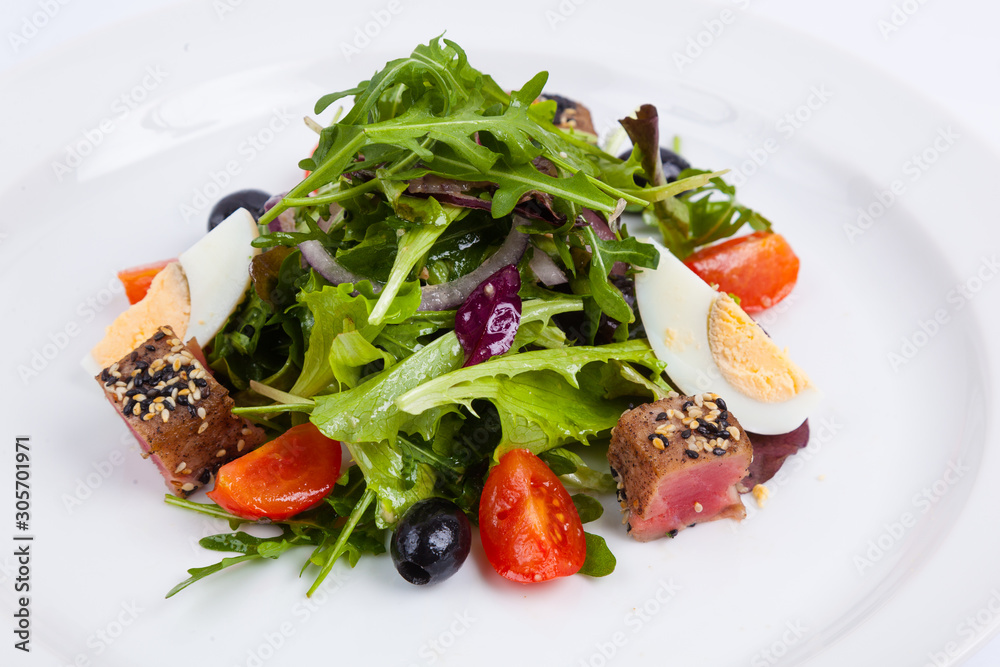 tuna salad and arugula with cherry tomatoes