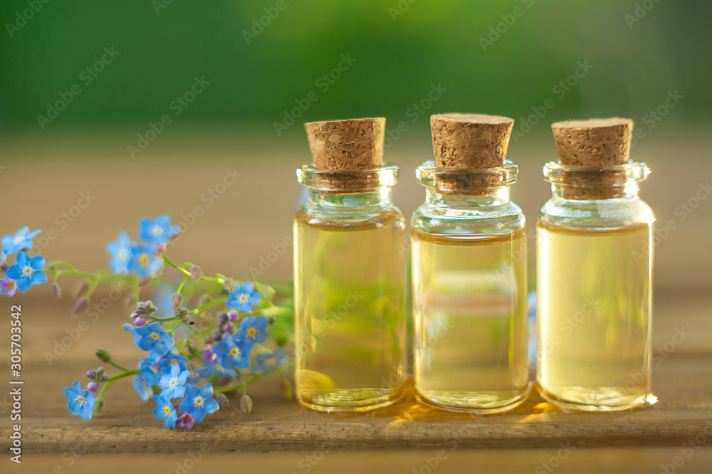 Essence of flowers on table in beautiful glass jar Essence of flowers on table in beautiful glass jar
