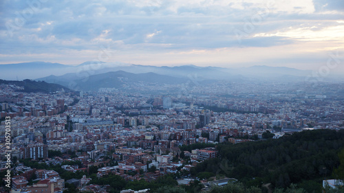 View of the stone city, dawn over Barcelona. © romanklevets