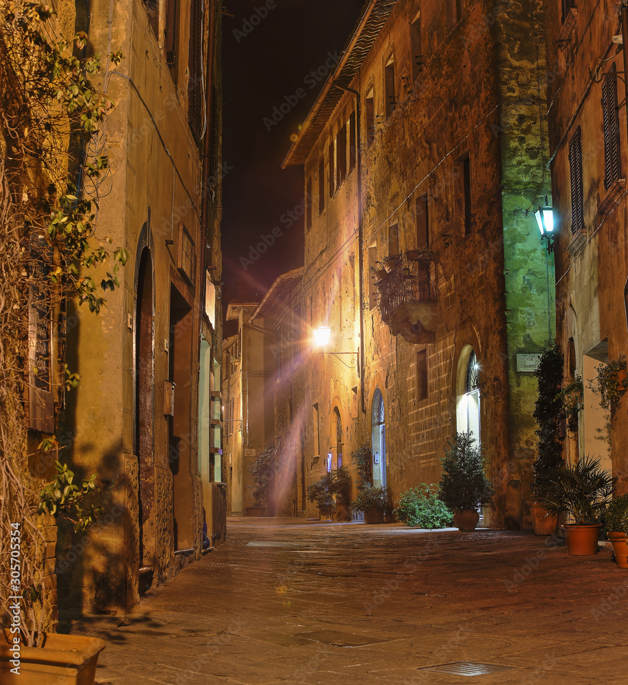 Fototapeta premium Beautiful Italian street of small old provincial town