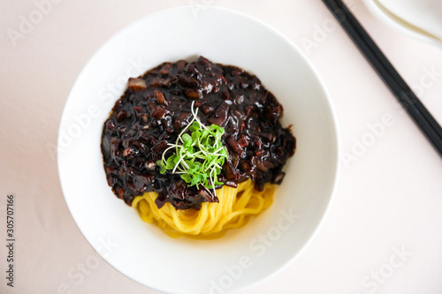 Top view image of Korean traditional food, Jajangmyeon black noodle on a white bowl