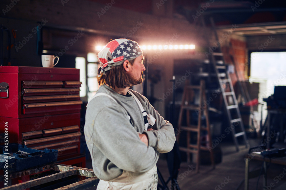 Handyman renovating interior, fixing and remodeling, working person with tools.