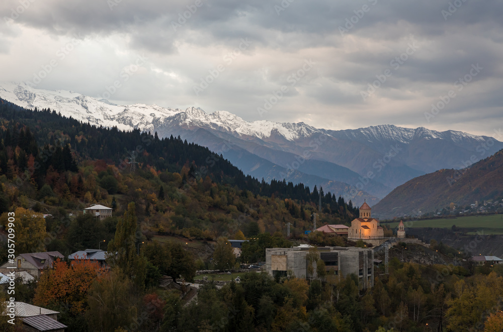 Early  morning panoramic view of Mestia village in Svaneti and the snow-capped peaks of the mountains in the distance in the mountainous part of Georgia