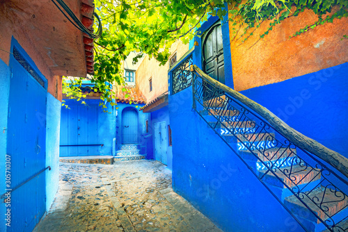 Colourful houses with blue painted walls in old medina of Chefchaouen. Morocco, North Africa photo