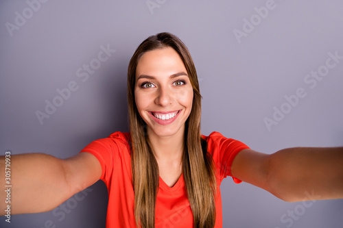 Close up photo of positive cheerful girl make self portrait on travel journey feel content emotions wear stylish clothing isolated over grey color background