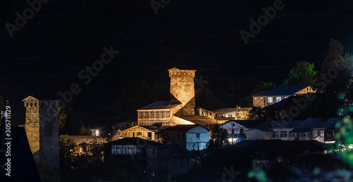 Night panoramic view of the village of Mestia in Svaneti and the illuminated watchtowers - Koshki in the mountainous part of Georgia