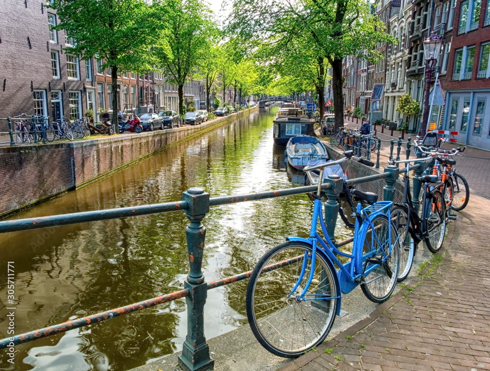 Typical canal and bikes in Amsterdam, Netherlands