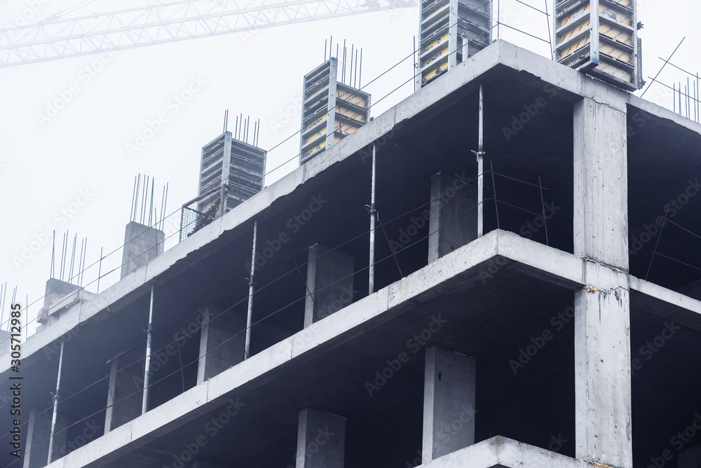 Construction of monolithic concrete construction with construction crane. Housing. Construction of monolithic concrete construction with construction crane. Housing.